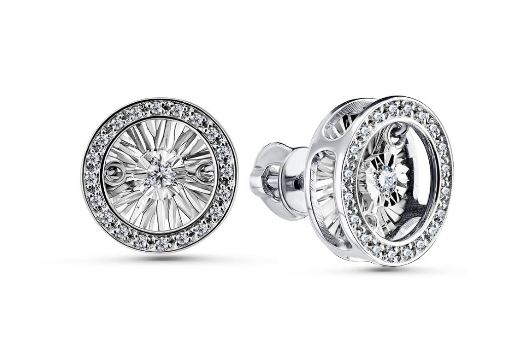 Серьги пусеты из белого золота с танцующим бриллиантом
