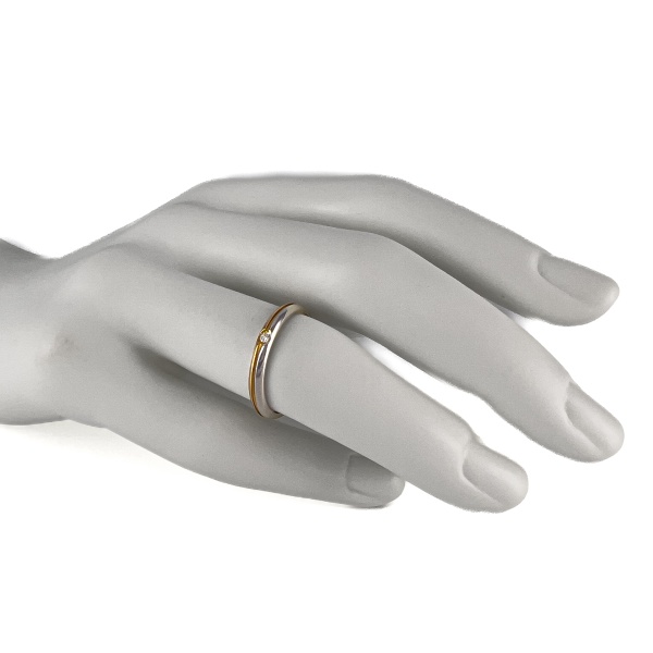 Обручальное кольцо из комбинированного золота с бриллиантом