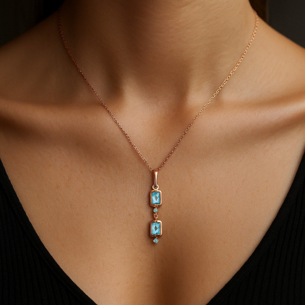 Подвеска из красного золота с топазами